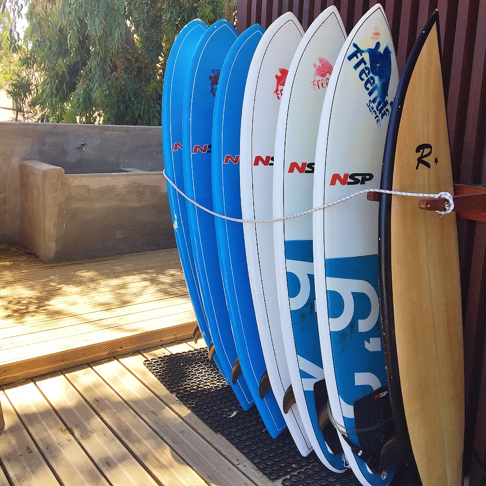 Surfboards lined up at FreeRide Surf School, Sagres